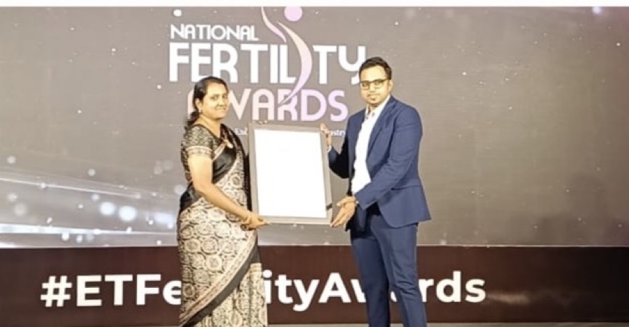 Receiving the National Fertility Award on stage